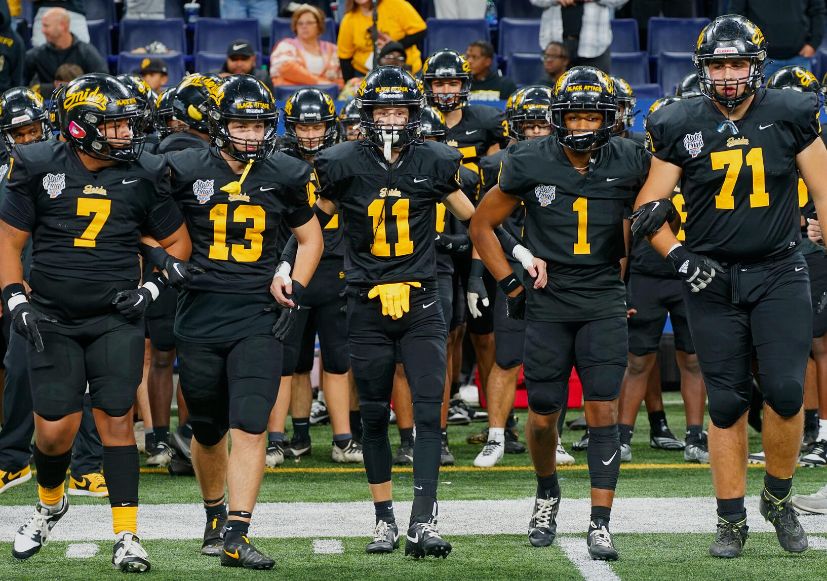 Fort Wayne Snider Panther American Football team runs out onto the Spuller Stadium field as visitors on the campus of Northrop High School.